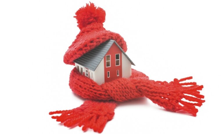 A house with heating issues wrapped in a scarf to keep warm.